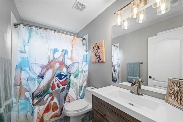bathroom featuring vanity, toilet, and a shower with shower curtain