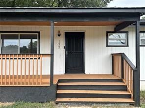 doorway to property featuring a porch