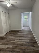 hall with dark hardwood / wood-style floors