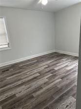 empty room featuring dark wood-type flooring