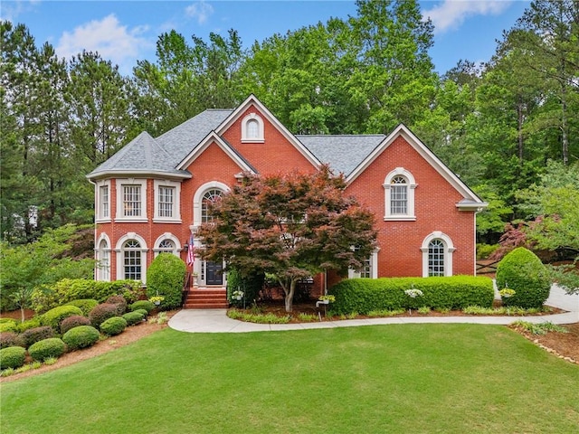 775 Barberry Dr, Milton, GA 30004 - colonial-style house featuring brick siding and a front yard