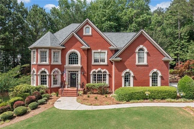 775 Barberry Dr, Milton, GA 30004 - colonial house featuring brick siding and a front yard