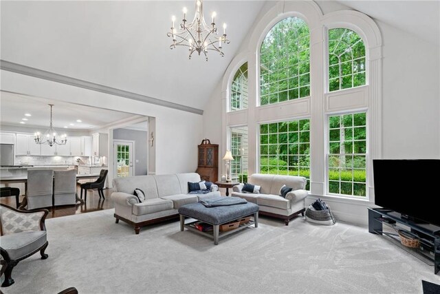 775 Barberry Dr, Milton, GA 30004 - carpeted living area featuring a chandelier, high vaulted ceiling, healthy amount of natural light, a fireplace, and baseboards