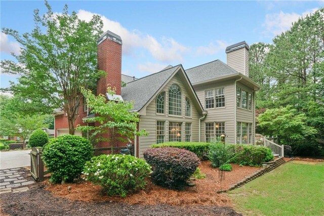 775 Barberry Dr, Milton, GA 30004 - colonial-style house with brick siding and a front yard