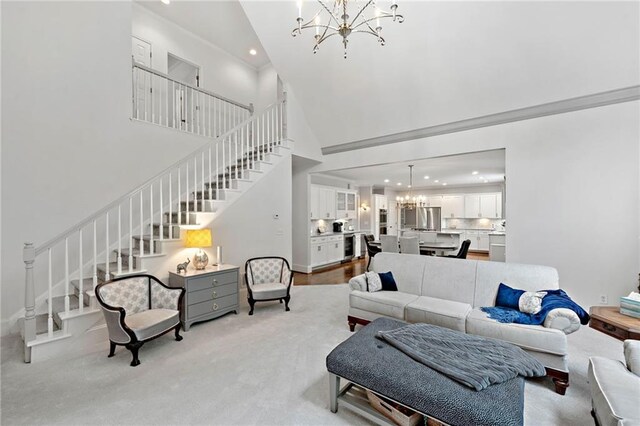 775 Barberry Dr, Milton, GA 30004 - living area featuring a chandelier, a high ceiling, stairs, and recessed lighting