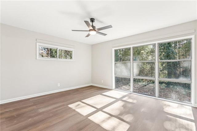 spare room featuring hardwood / wood-style flooring and ceiling fan