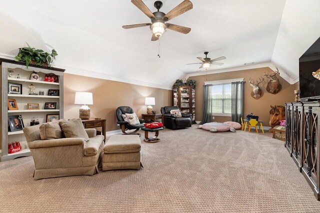 living room with vaulted ceiling, ceiling fan, and light colored carpet