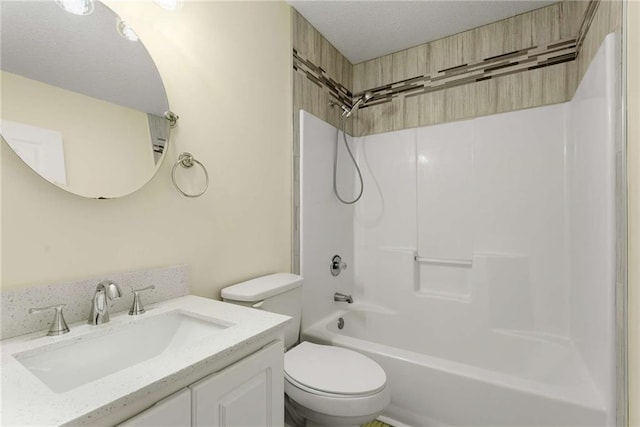 full bath with bathtub / shower combination, vanity, and toilet