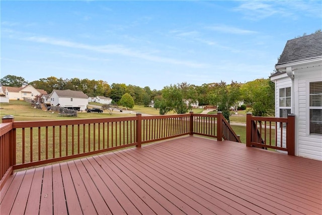 deck featuring a yard and a residential view