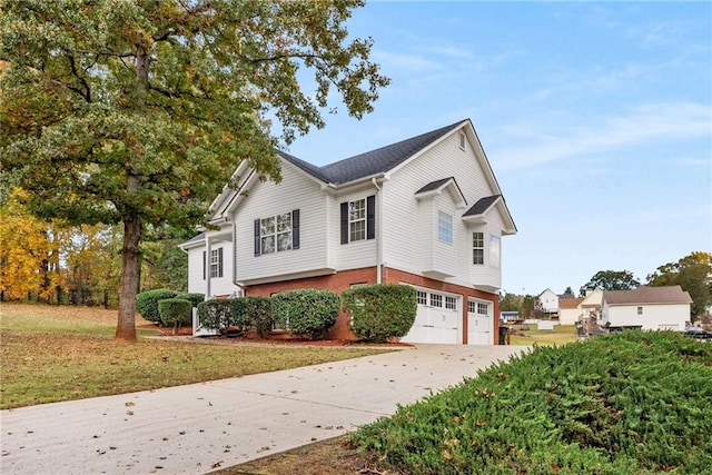 view of front of property with a garage and a front yard