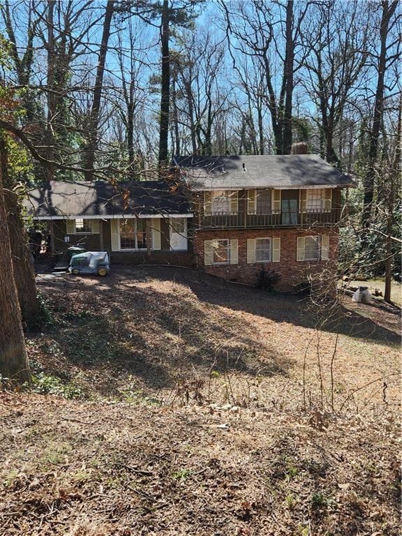 view of front of home featuring brick siding