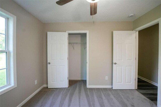 212 Cobb St, Cedartown, GA 30125 - unfurnished bedroom with baseboards, multiple windows, carpet, and a closet