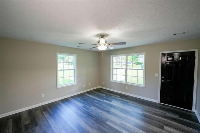212 Cobb St, Cedartown, GA 30125 - interior space featuring ceiling fan, dark wood-style flooring, a textured ceiling, visible vents, and baseboards