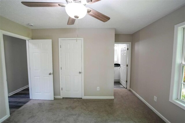 212 Cobb St, Cedartown, GA 30125 - unfurnished bedroom with baseboards, carpet, a ceiling fan, and ensuite bath