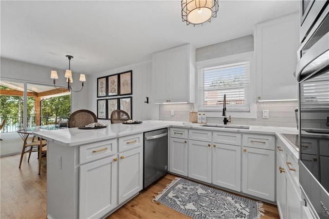 6160 Lake Lanier Heights Rd, Buford, GA 30518 - kitchen featuring dishwasher, a peninsula, light wood-style flooring, and white cabinetry
