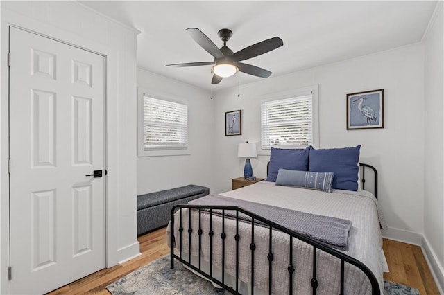 6160 Lake Lanier Heights Rd, Buford, GA 30518 - bedroom featuring multiple windows, wood finished floors, and a ceiling fan
