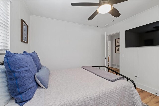 6160 Lake Lanier Heights Rd, Buford, GA 30518 - bedroom featuring wood finished floors, ceiling fan, and crown molding