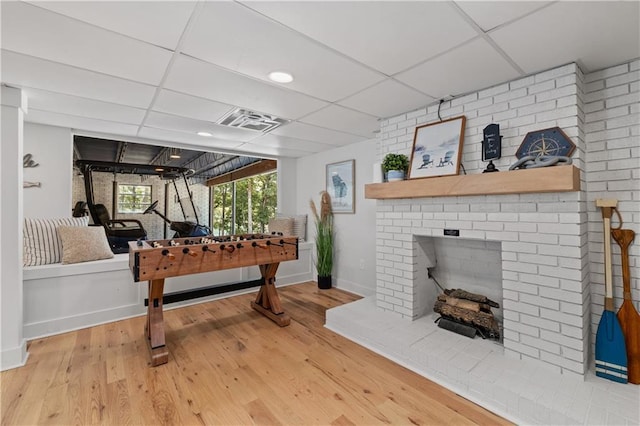 6160 Lake Lanier Heights Rd, Buford, GA 30518 - rec room featuring a drop ceiling, a fireplace, and wood finished floors