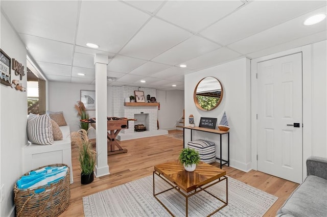 6160 Lake Lanier Heights Rd, Buford, GA 30518 - living room with light wood finished floors, a brick fireplace, recessed lighting, and a paneled ceiling