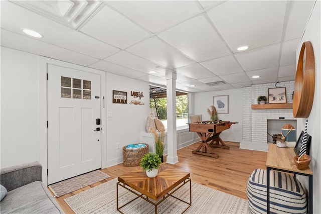 6160 Lake Lanier Heights Rd, Buford, GA 30518 - living room featuring light wood finished floors, a fireplace, recessed lighting, and a paneled ceiling