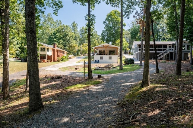 6160 Lake Lanier Heights Rd, Buford, GA 30518 - view of dirt / gravel driveway featuring stairway and view of wooded area