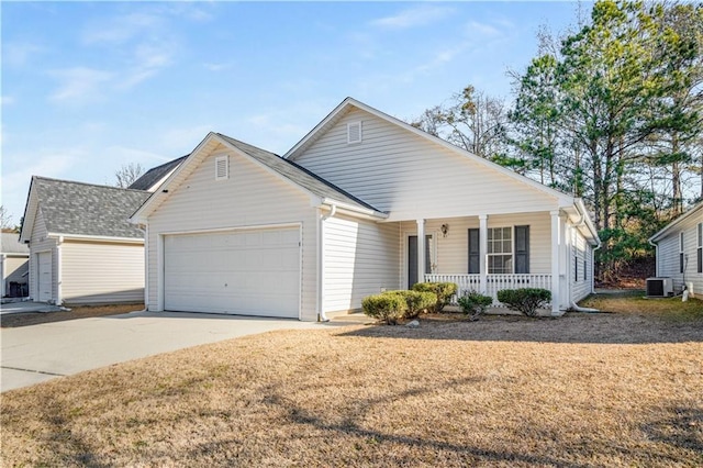 view of front facade featuring a garage, a front yard, cooling unit, and covered porch