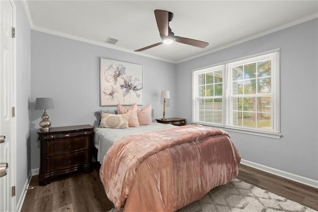 1245 Meriwether St, Griffin, GA 30224 - bedroom featuring dark wood-type flooring, baseboards, ornamental molding, and ceiling fan