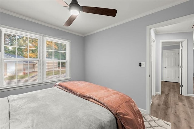 1245 Meriwether St, Griffin, GA 30224 - bedroom featuring baseboards, light wood-style flooring, ornamental molding, and ceiling fan