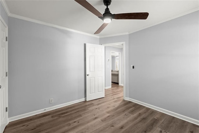 1245 Meriwether St, Griffin, GA 30224 - unfurnished bedroom featuring wood finished floors, baseboards, crown molding, and ceiling fan