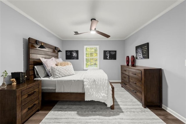 1245 Meriwether St, Griffin, GA 30224 - bedroom with crown molding, baseboards, wood finished floors, and ceiling fan