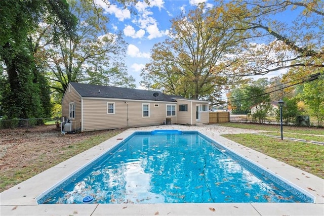 1245 Meriwether St, Griffin, GA 30224 - rear view of property featuring an outdoor pool and a fenced backyard