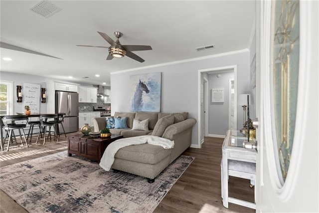 1245 Meriwether St, Griffin, GA 30224 - living room featuring ceiling fan, baseboards, wood finished floors, recessed lighting, and ornamental molding