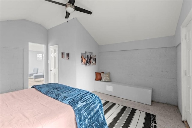 1245 Meriwether St, Griffin, GA 30224 - bedroom featuring vaulted ceiling, concrete block wall, carpet flooring, and ceiling fan