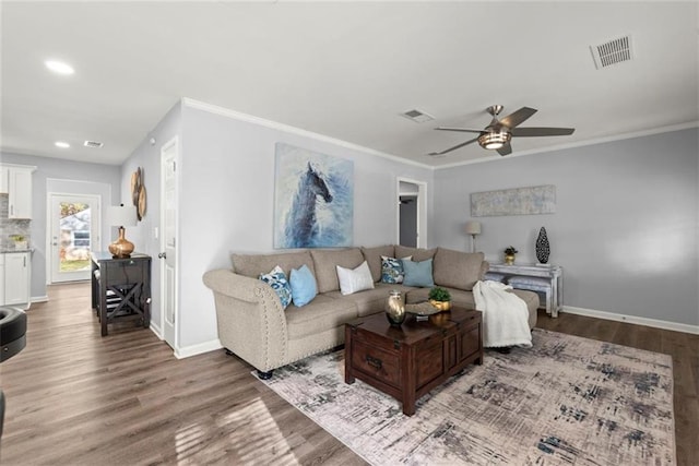 1245 Meriwether St, Griffin, GA 30224 - living room with ceiling fan, wood finished floors, baseboards, crown molding, and recessed lighting