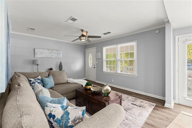 1245 Meriwether St, Griffin, GA 30224 - living area featuring baseboards, ceiling fan, crown molding, plenty of natural light, and wood finished floors