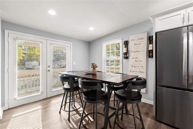 1245 Meriwether St, Griffin, GA 30224 - dining room with french doors, dark wood-style floors, lofted ceiling, recessed lighting, and baseboards