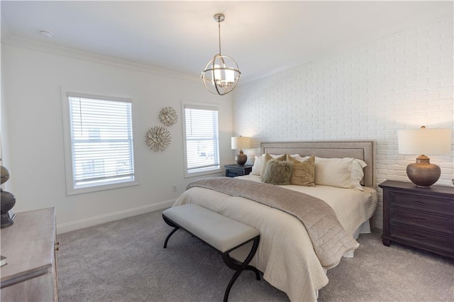 510 Healy Dr Unit 71, Cumming, GA 30040 - bedroom with light carpet, ornamental molding, an inviting chandelier, brick wall, and baseboards