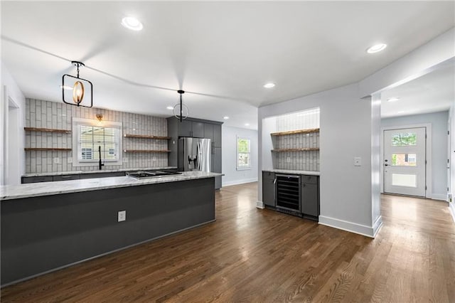 957 Sharon Cir SE, Smyrna, GA 30080 - kitchen featuring open shelves, beverage cooler, appliances with stainless steel finishes, backsplash, and dark wood finished floors