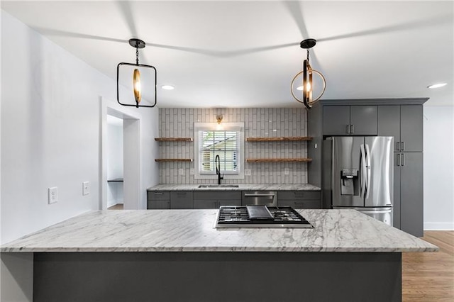 957 Sharon Cir SE, Smyrna, GA 30080 - kitchen featuring stainless steel appliances, a sink, gray cabinets, open shelves, and decorative backsplash