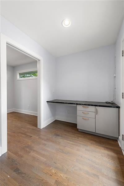 957 Sharon Cir SE, Smyrna, GA 30080 - kitchen featuring baseboards, light wood-style flooring, and white cabinets