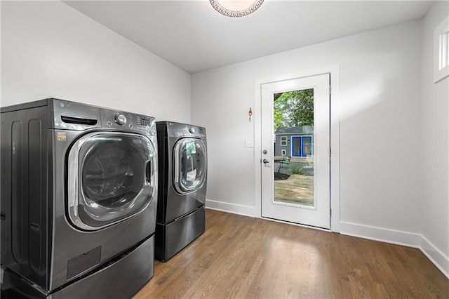 957 Sharon Cir SE, Smyrna, GA 30080 - washroom featuring independent washer and dryer, wood finished floors, and baseboards