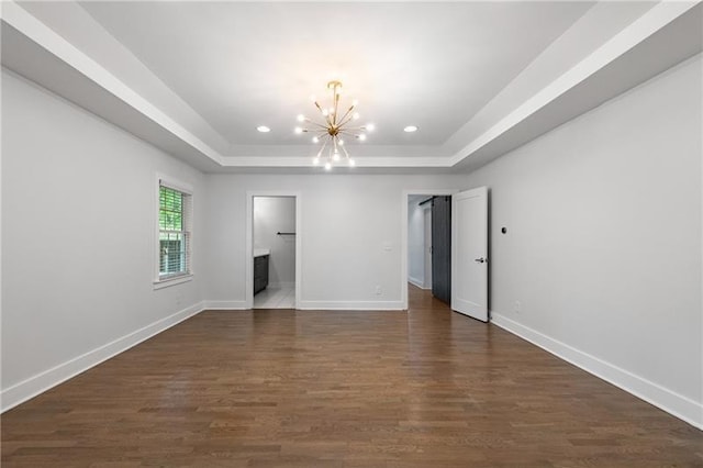 957 Sharon Cir SE, Smyrna, GA 30080 - unfurnished bedroom featuring a chandelier, a raised ceiling, baseboards, recessed lighting, and dark wood-type flooring