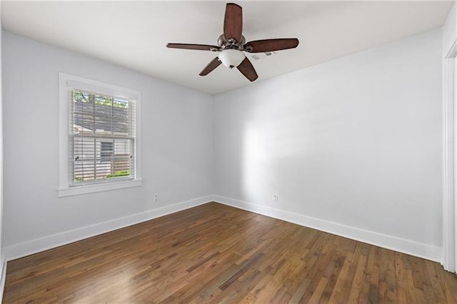 957 Sharon Cir SE, Smyrna, GA 30080 - empty room featuring baseboards, dark wood-style floors, and ceiling fan