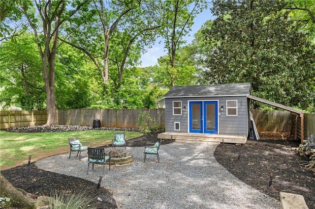 957 Sharon Cir SE, Smyrna, GA 30080 - view of patio with an outdoor structure and an outdoor fire pit
