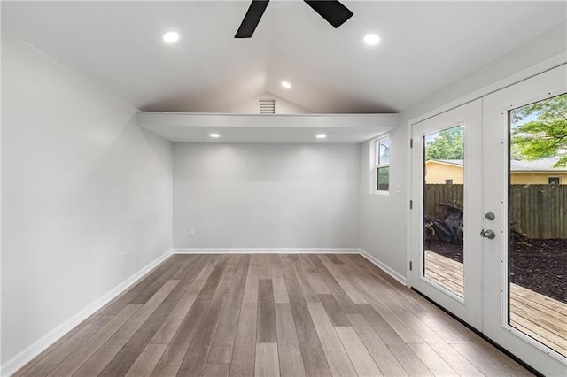957 Sharon Cir SE, Smyrna, GA 30080 - spare room with a ceiling fan, wood finished floors, vaulted ceiling, baseboards, and french doors