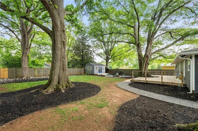 957 Sharon Cir SE, Smyrna, GA 30080 - view of yard featuring a wooden deck and an outdoor structure