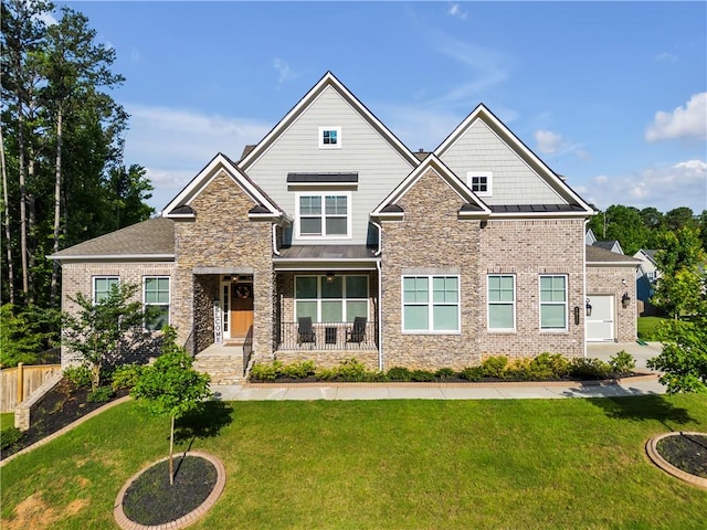 craftsman-style home featuring a front yard