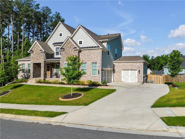 craftsman-style house featuring a garage and a front yard