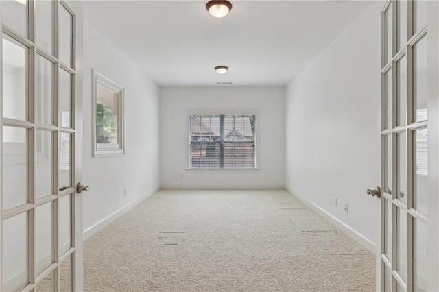 4540 Hastings Dr, Cumming, GA 30041 - carpeted empty room featuring french doors and baseboards
