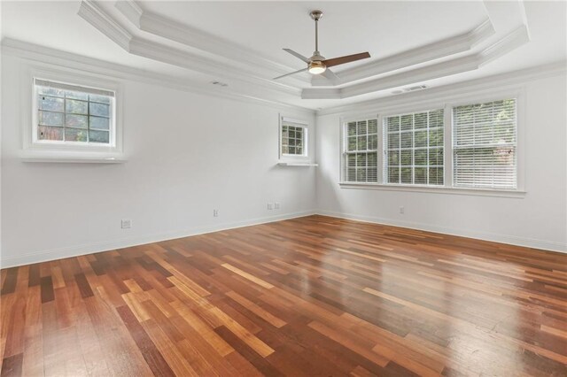 4540 Hastings Dr, Cumming, GA 30041 - empty room with ornamental molding, a raised ceiling, hardwood / wood-style floors, ceiling fan, and baseboards